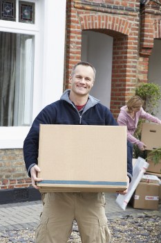 Removal van and moving team preparing a residential move in North Harrow