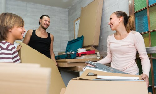 Removal team planning a North Harrow house move with packing boxes