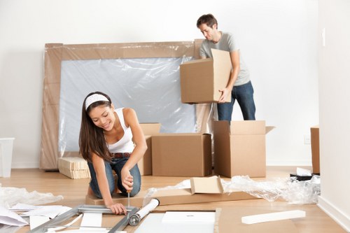 Commercial moving team preparing office equipment for relocation in North Harrow