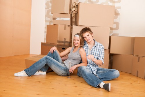 Removal van and moving team preparing a house move in North Harrow