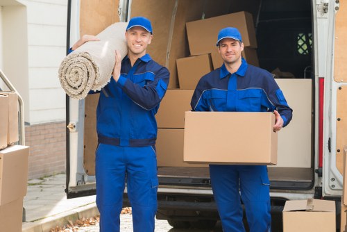 Local moving team handling boxes and household items in North Harrow