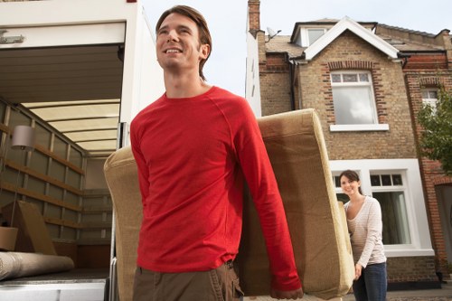 Careful loading of household items into a moving van