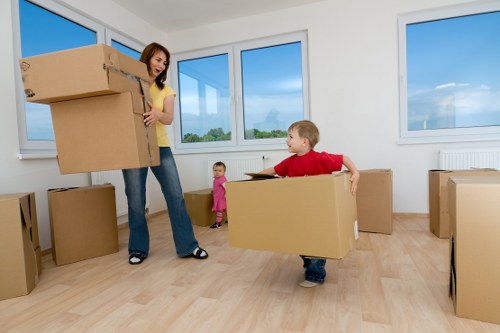 Careful wrapping of fragile household items during packing