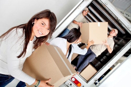 Household furniture and boxes being moved by van