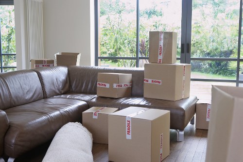 Professional movers handling furniture and boxes in North Harrow